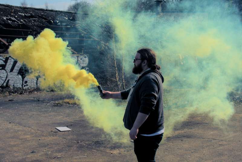 Adam with a smoke grenade